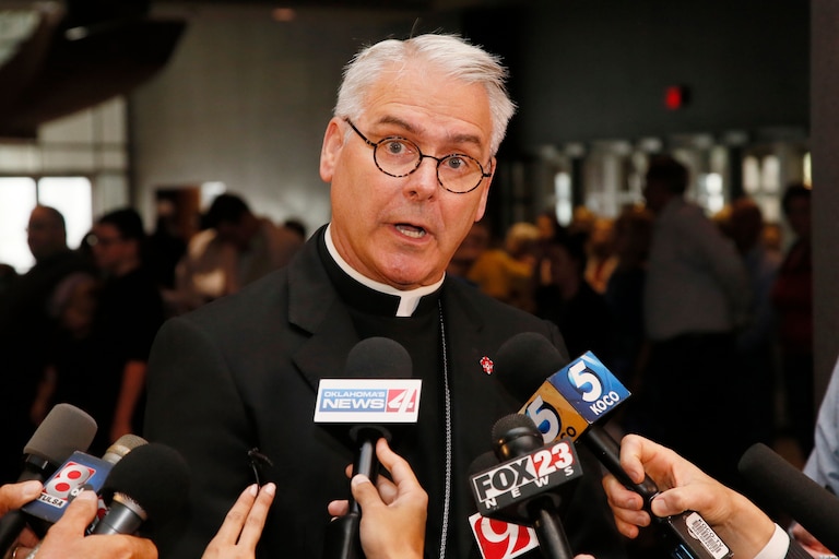 FILE - Archbishop Paul Coakley speaks to the media before the Beatification Ceremony for Stanley Rother in Oklahoma City, Sept. 23, 2017. (AP Photo/Sue Ogrocki, File)