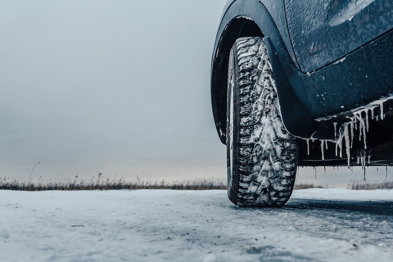 Car rides on an icy road. Slippery ice road.