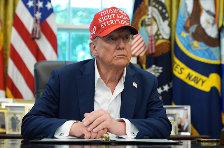 President Donald Trump speaks with reporters in the Oval Office of the White House, Friday, Aug. 22, 2025, in Washington.