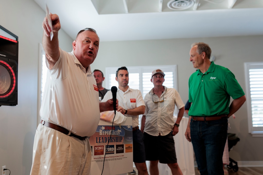 Nino Mangione’s campaign consultant Kelley Rogers introduces the Republican candidates at an Early Voting Meet and Greet event at Brookside Market.