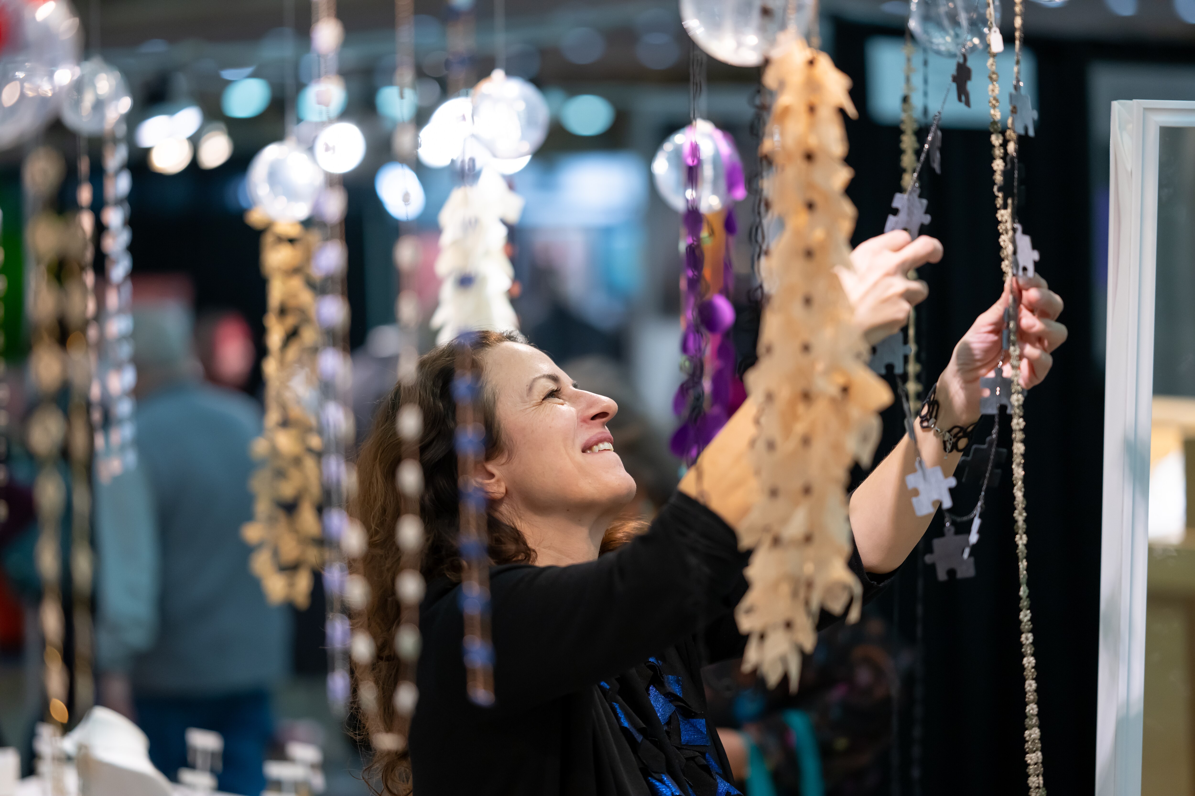 A shot of an attendee at the 2024 American Craft Made in Baltimore, the the largest juried craft fair on the East Coast.