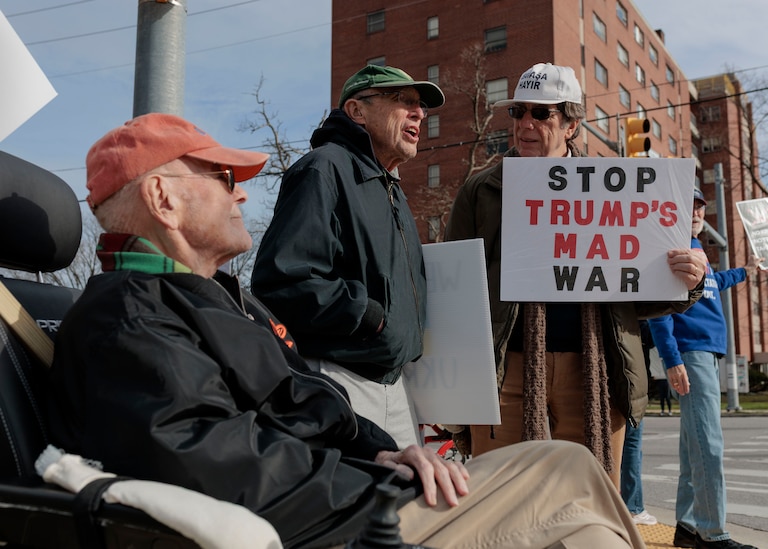 From left, Bill Mules, 84, Buzzy Hettleman, 90, and Howie Baum, 80, gather with fellow residents of the Roland Park Place senior living complex for a weekly protest in Baltimore’s Hampden neighborhood.