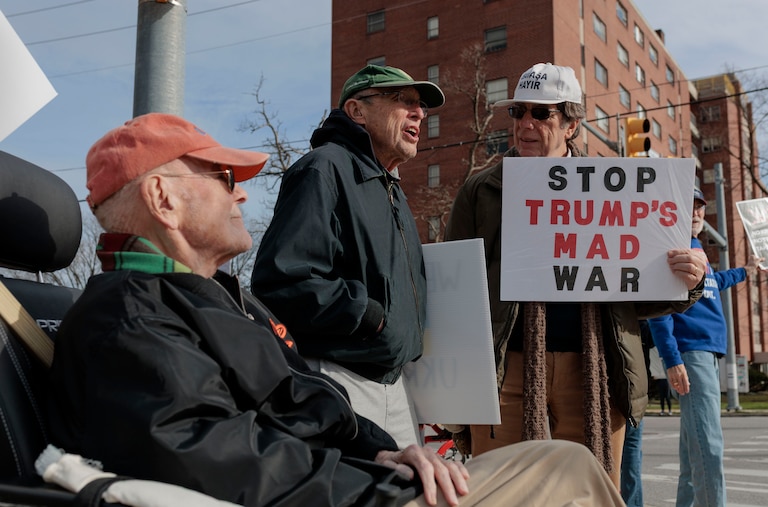 From left, Bill Mules, 84, Buzzy Hettleman, 90, and Howie Baum, 80, gather with fellow residents of the Roland Park Place senior living complex for a weekly protest in Baltimore’s Hampden neighborhood.