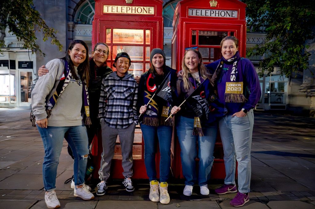 Ravens fans who traveled from Baltimore to London pose for a portrait on Oct. 14, 2023.
