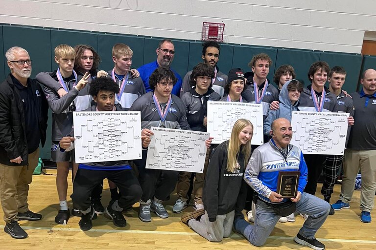 Sparrows Point displays its awards after its third consecutive team title at the Baltimore County wrestling tournament.