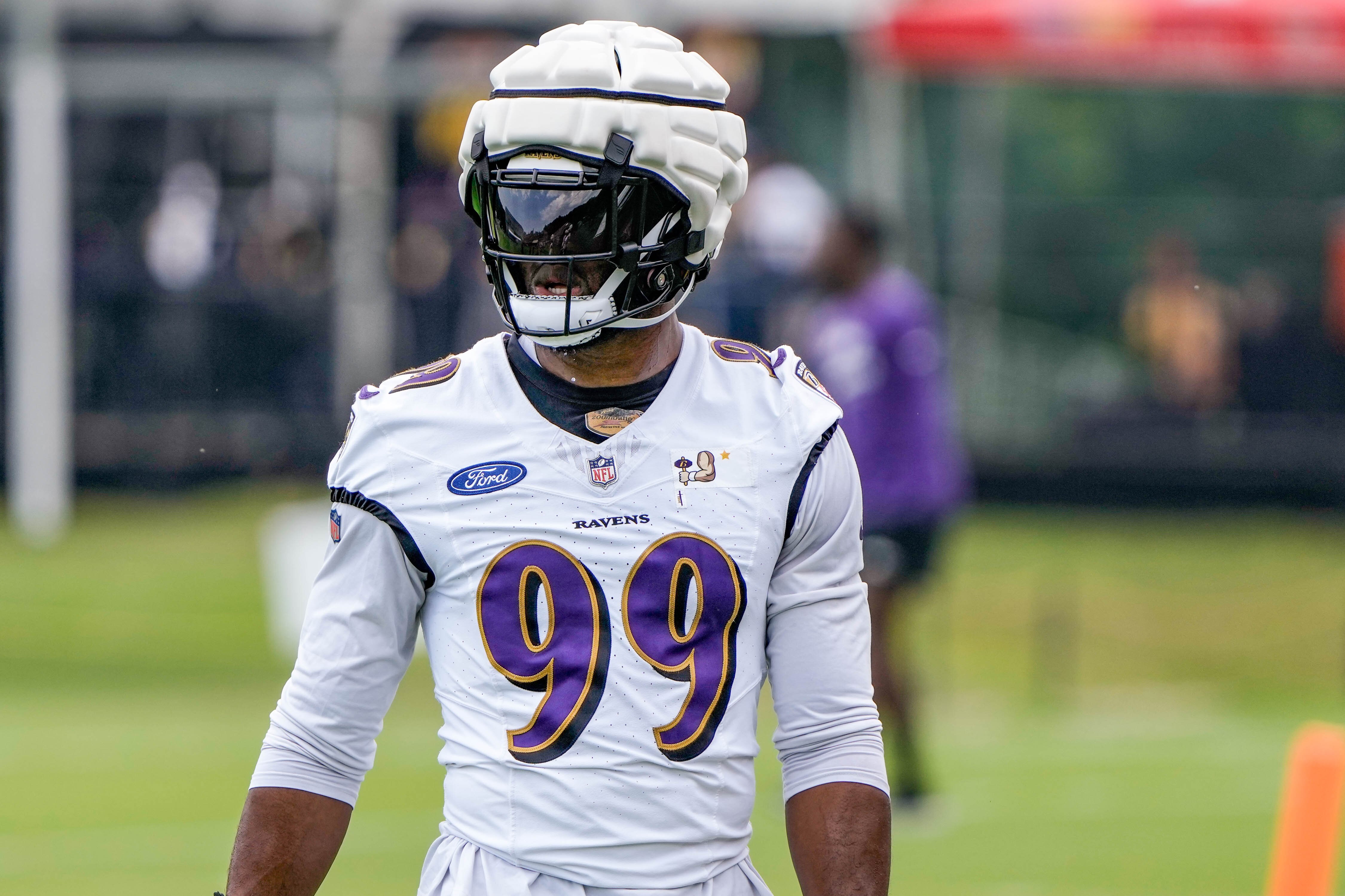 Ravens OLB Odafe Oweh stands on the field during Ravens practice in Owings Mills on July 27, 2023.