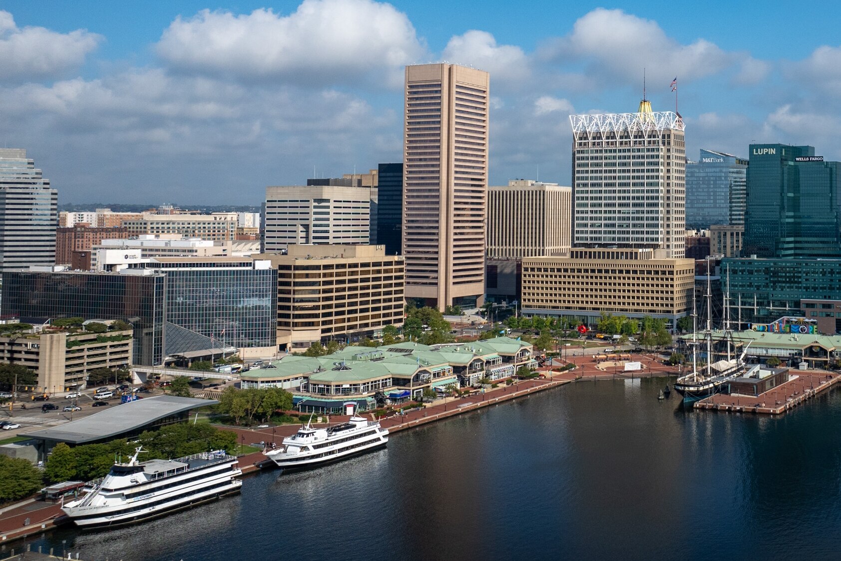 The Baltimore skyline is seen above the Harborplace pavilions and the Inner Harbor.