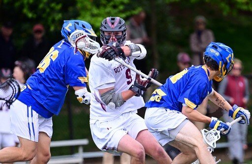 Boys' Latin's Jackson Walsh splits two Loyola defenders during Tuesday's MIAA A Conference lacrosse game. Walsh finished with three goals as the No. 3 Lakers handed the top-ranked Dons their first league loss in a 12-5 decision at J. Duncan Smith Field in Baltimore City.