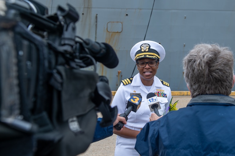 Then-Navy Cmdr. LaDonna Simpson speaks with reporters after bringing her ship back to port after a deployment in 2021. Now promoted to captain, she took over as commander of the Naval Support Activity Annapolis in August.