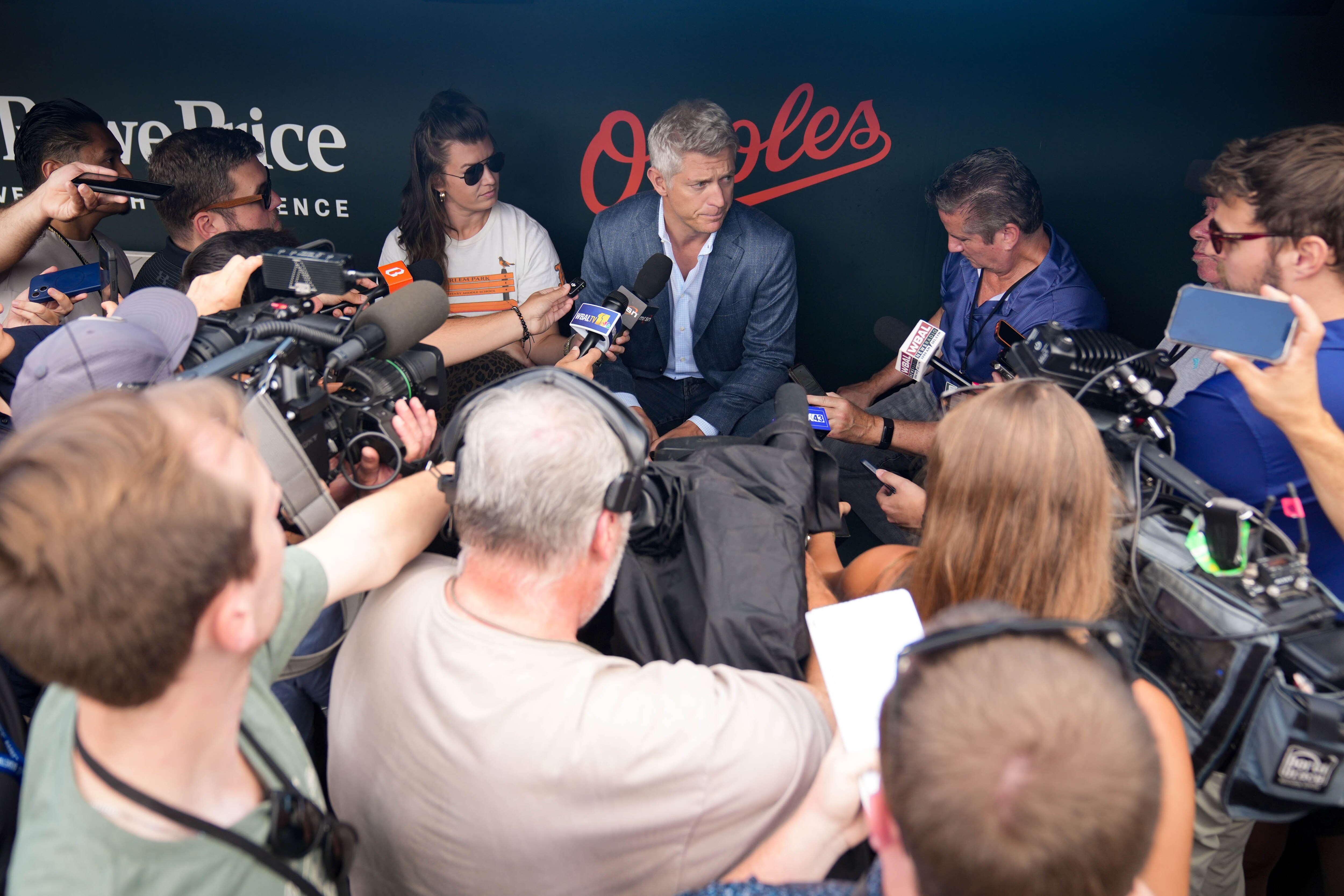Orioles president of baseball operations Mike Elias takes questions from reporters in the Orioles dugout on July 31.