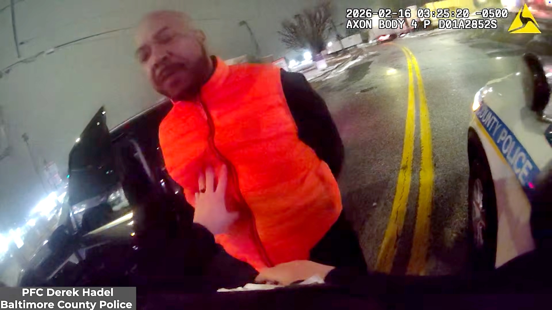 The Maryland Attorney General’s Office released body camera footage showing Samuel “Big Sam” Brown Jr.’s swatting away Baltimore County Police Officer Derek Hadel’s arm twice before he punches Brown twice — knocking him into the asphalt.
