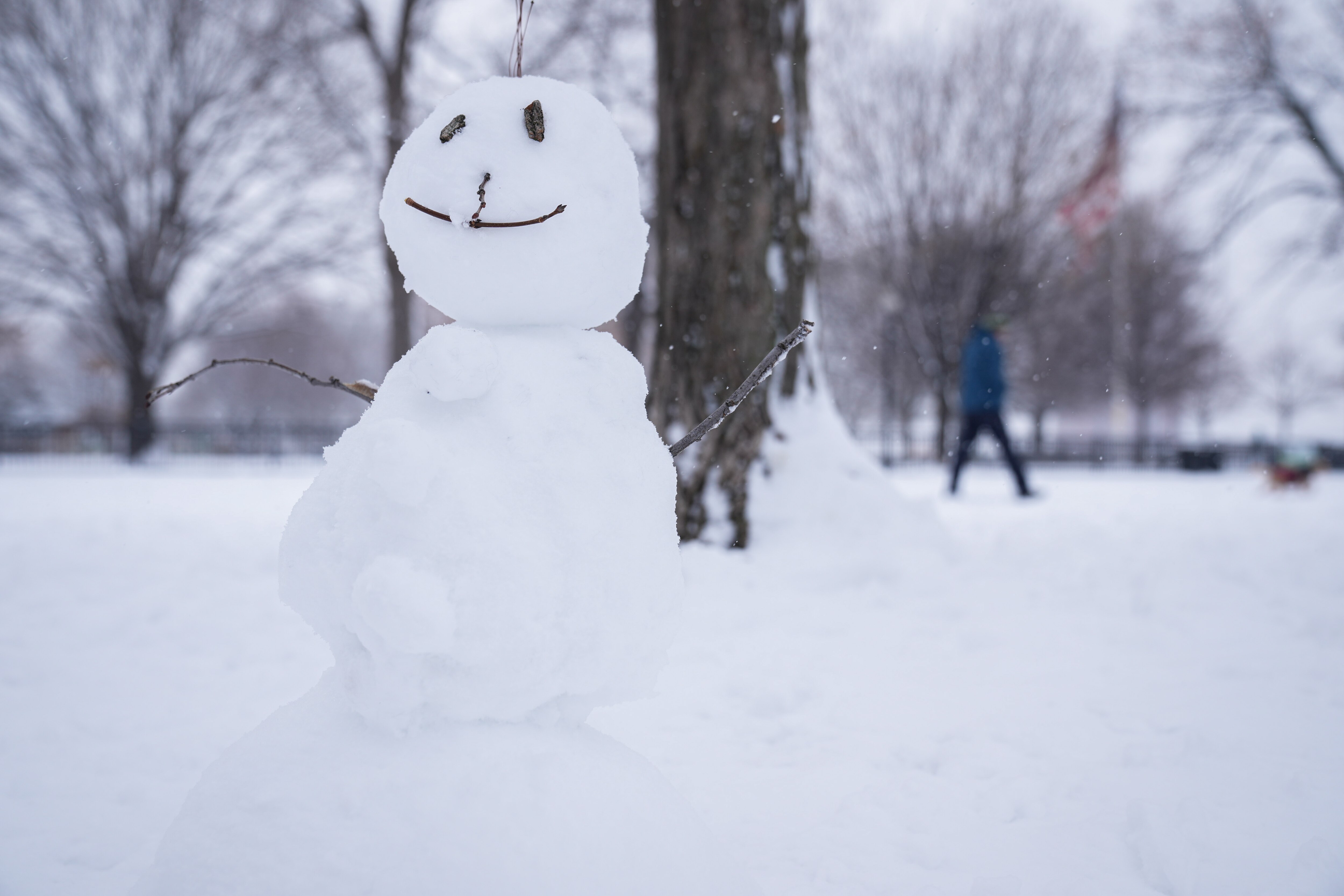 A snowman sits atop Federal Hill on a snowy day in Baltimore on January 19, 2024.