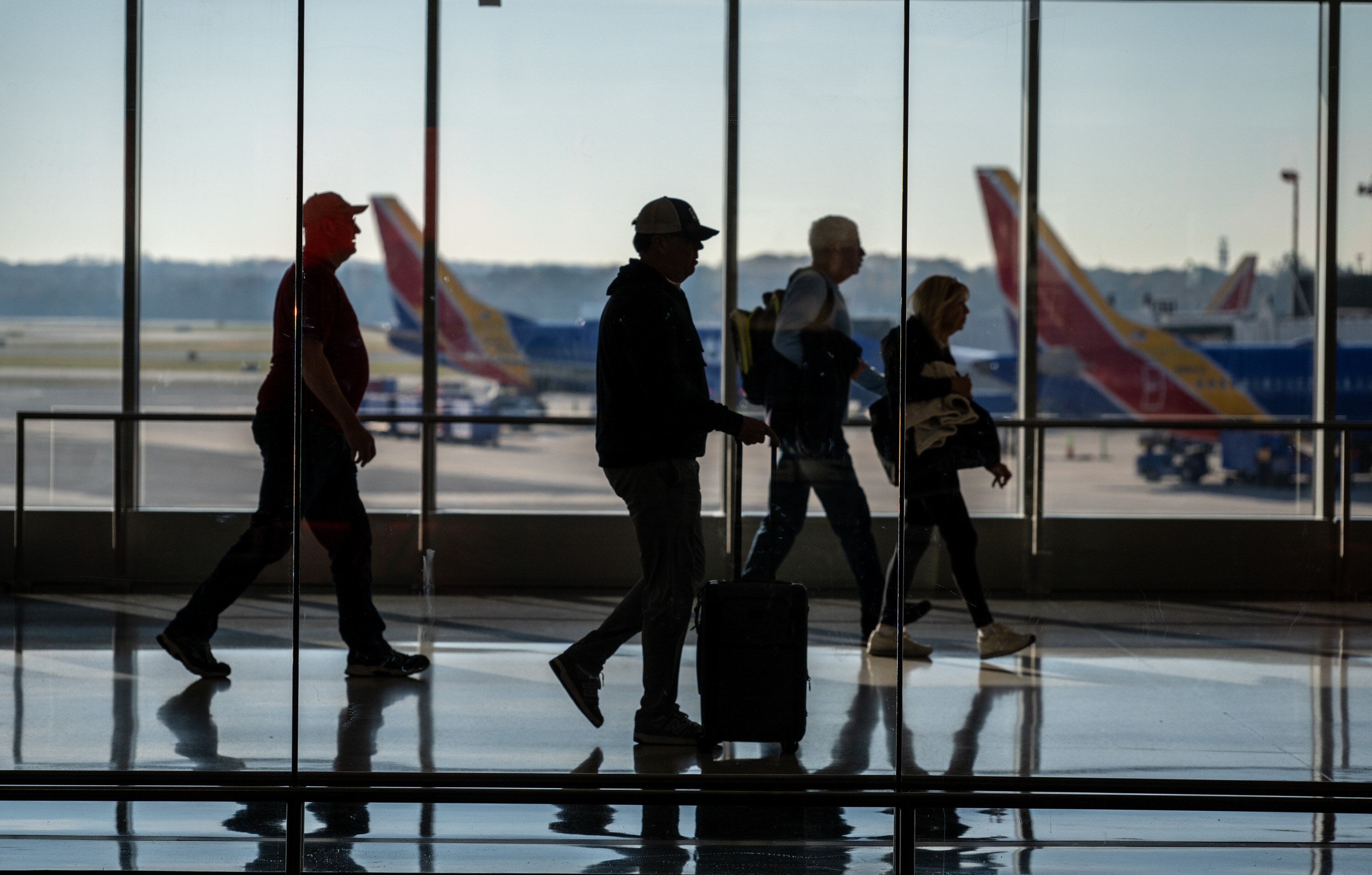 The FAA is imposing the flight reductions to relieve pressure on air traffic controllers who are working without pay during the government shutdown.