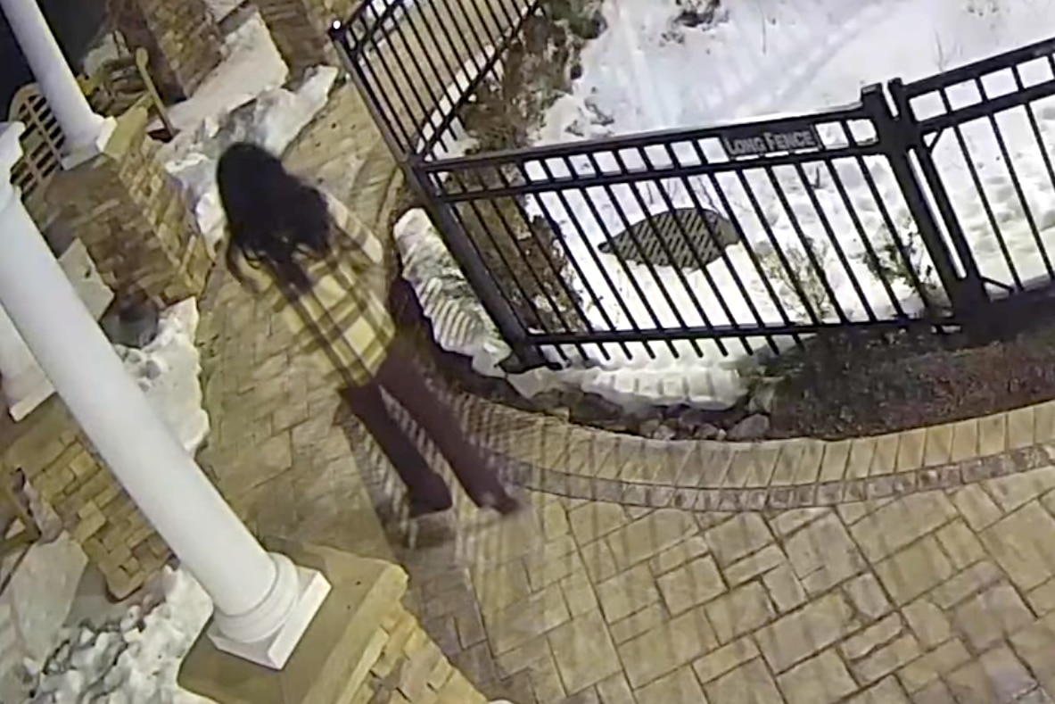 A video of the suspect police released on Friday shows the suspect with long dark hair from the back, wearing a flannel-type shirt and dark pants.