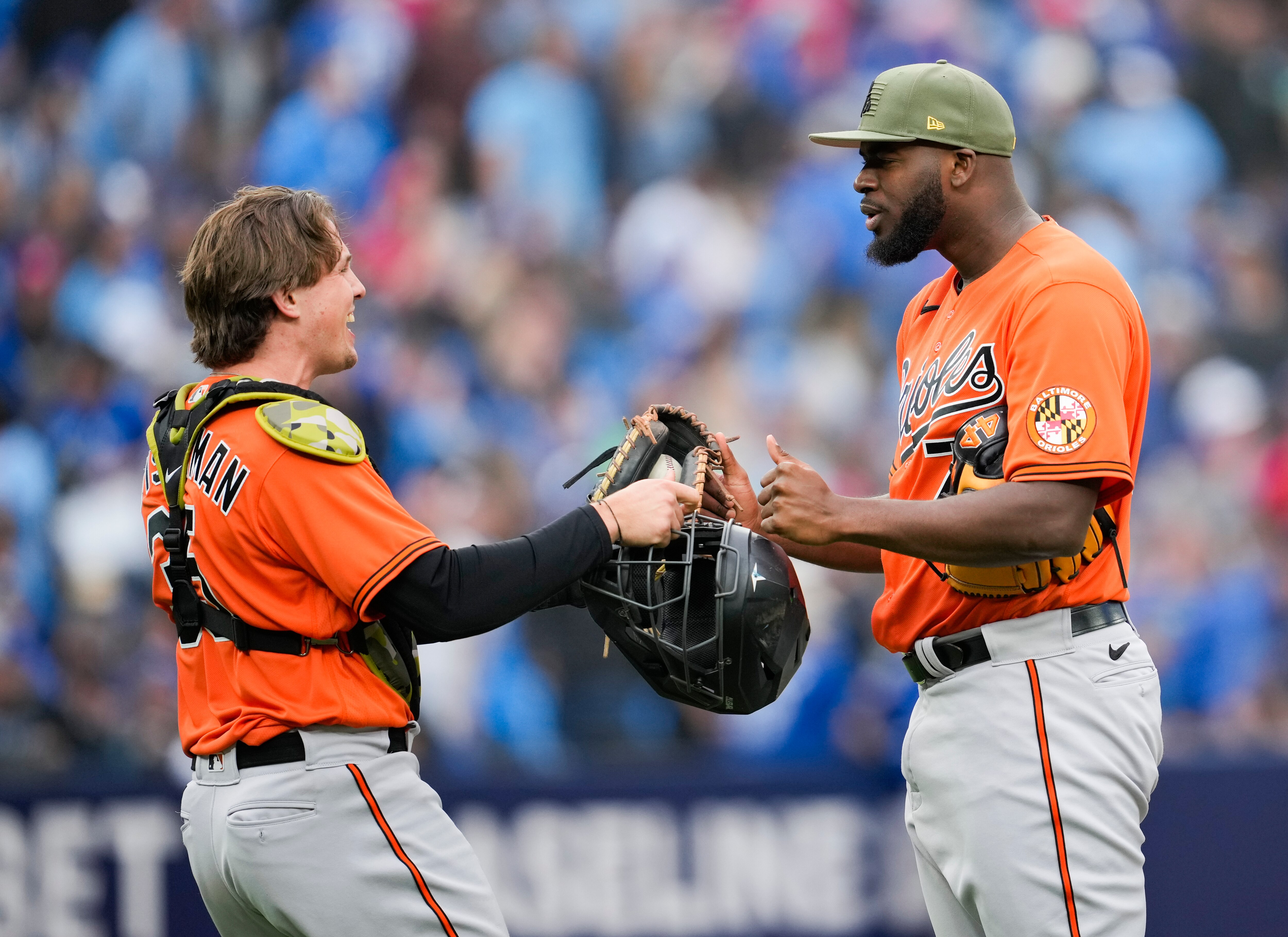 TORONTO, ON - MAY 20: Felix Bautista #74 and Adley Rutschman #35 of the Baltimore Orioles celebrate defeating the Toronto Blue Jays in their MLB game at the Rogers Centre on May 20, 2023 in Toronto, Ontario, Canada.