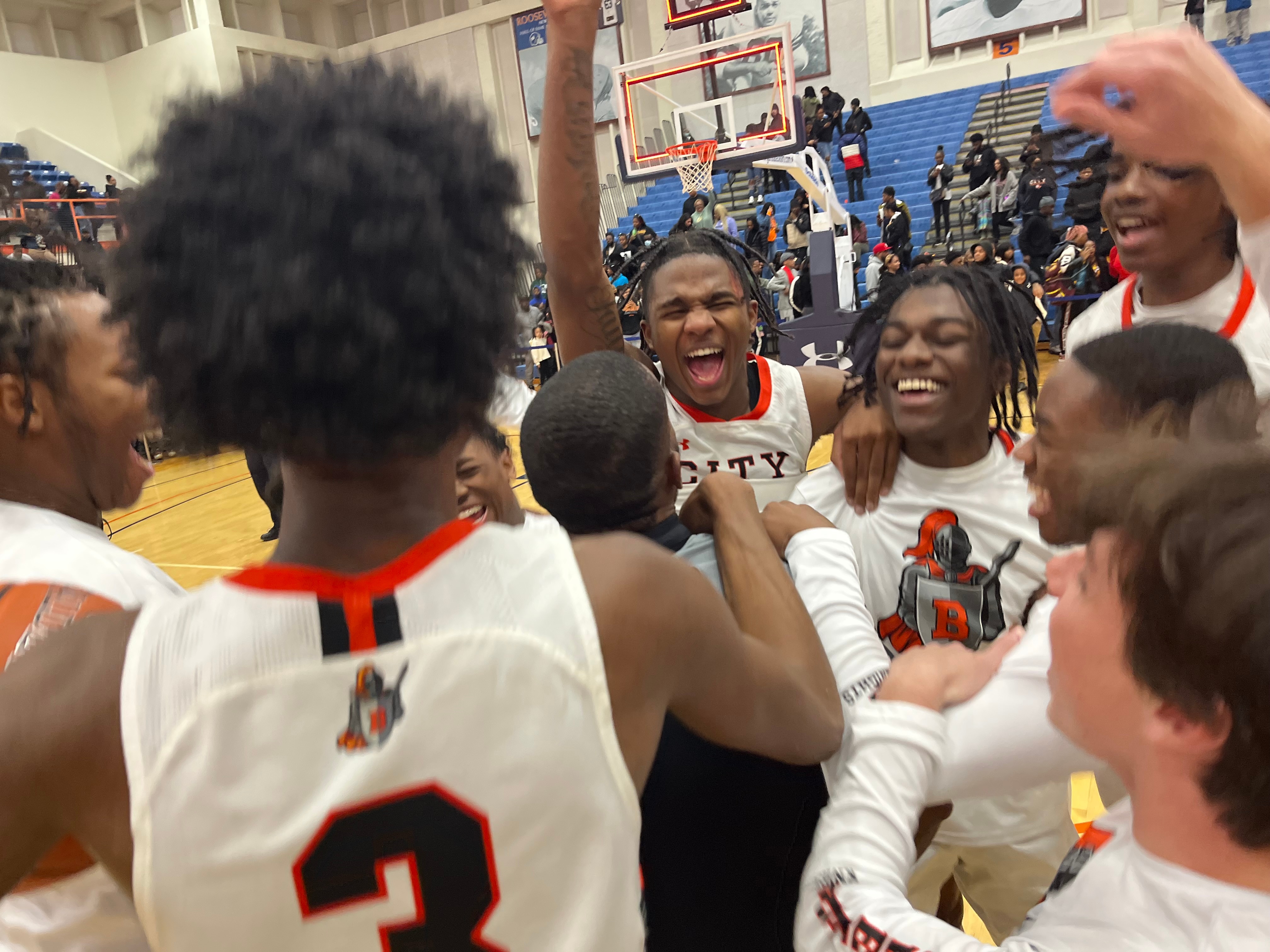 City players celebrate after winning the Baltimore City boys basketball championship Tuesday evening. The No. 3 Knights defeated Edmondson, 52-46, in front of 3,000 at Morgan State University.