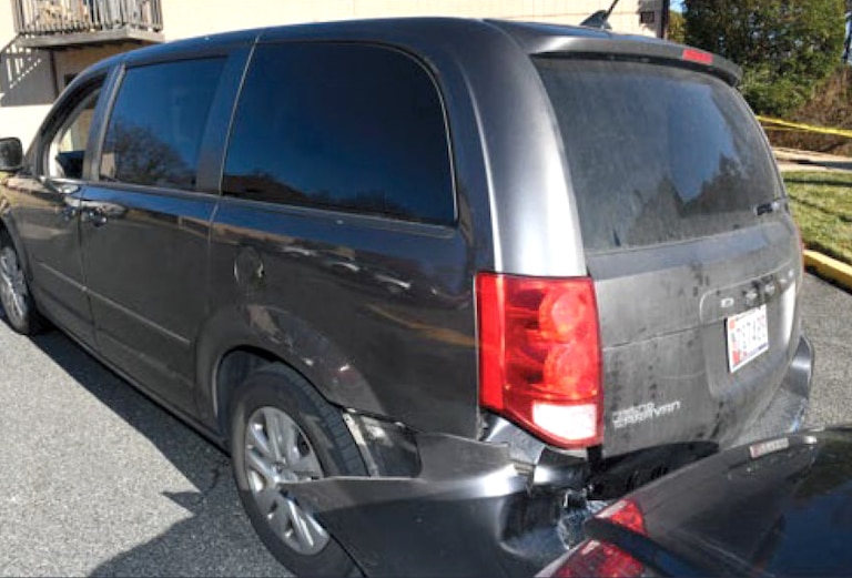 An image released in court documents of alleged damage to the rear bumper of a police vehicle in Glen Burnie on Dec. 24, 2025. Officers allege Tiago Sousa-Martins refused to leave his van, backing into a police vehicle parked behind him and forcing it into another vehicle behind that.