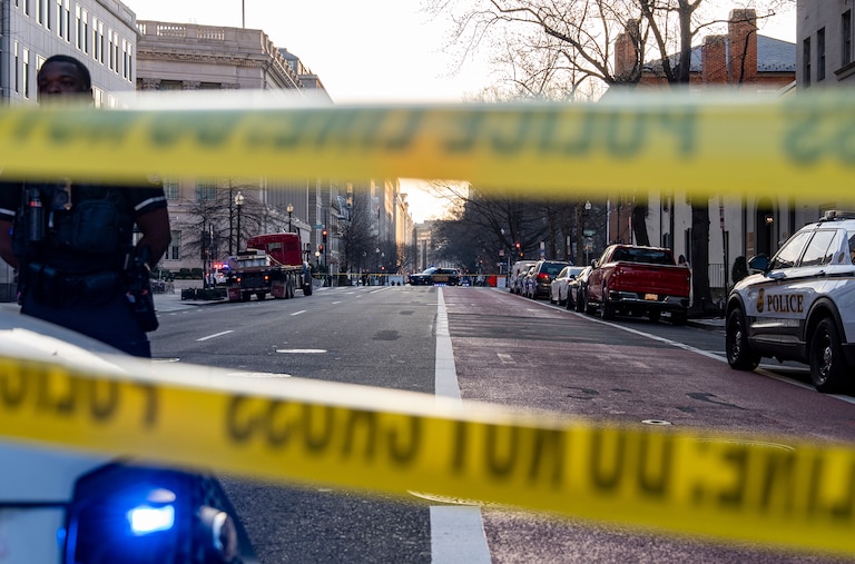 Washington Metropolitan Police Department officers block the streets around the White House.