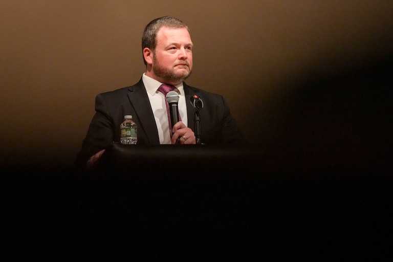 Baltimore County councilman Pat Young moderates a congressional town hall meeting at Woodlawn High School in Woodlawn, Md. on Thursday, March 20, 2025.