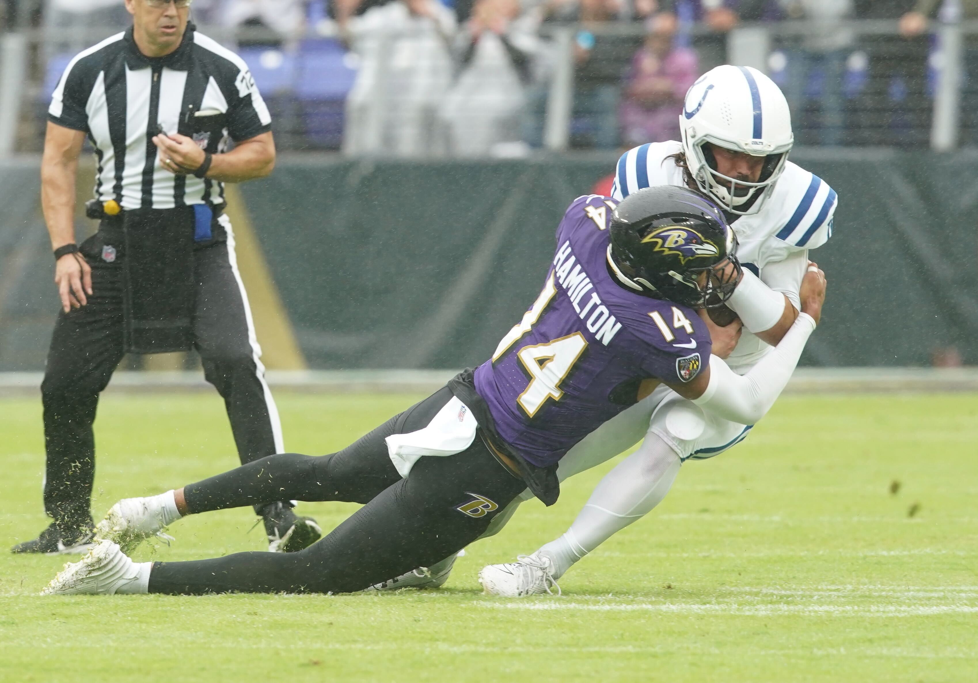 Ravens safety Kyle Hamilton records one of his two sacks in the first quarter against the Colts at M&T Bank Stadium.