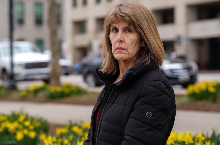 Isabel Mercedes Cumming, Baltimore City's Inspector General, sits for a portrait in War Memorial Plaza on Monday, March 13.