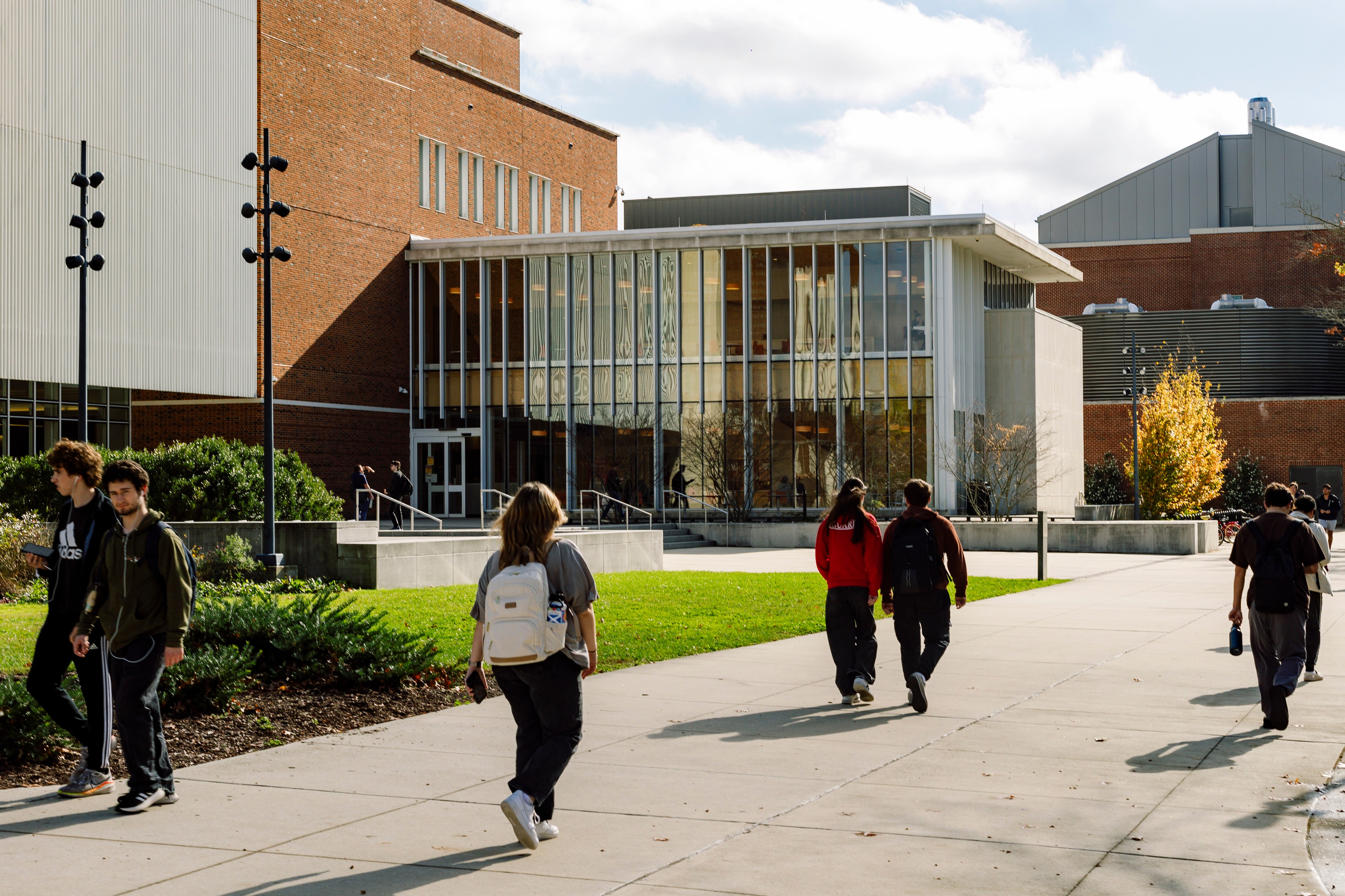 Students walk outside the Guerrieri Academic Commons at Salisbury University, where 15 students were charged in an off-campus attack.