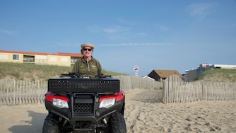 Tim Miller with the town of Ocean City's beach code enforcement team starts his shift at 65th Street.