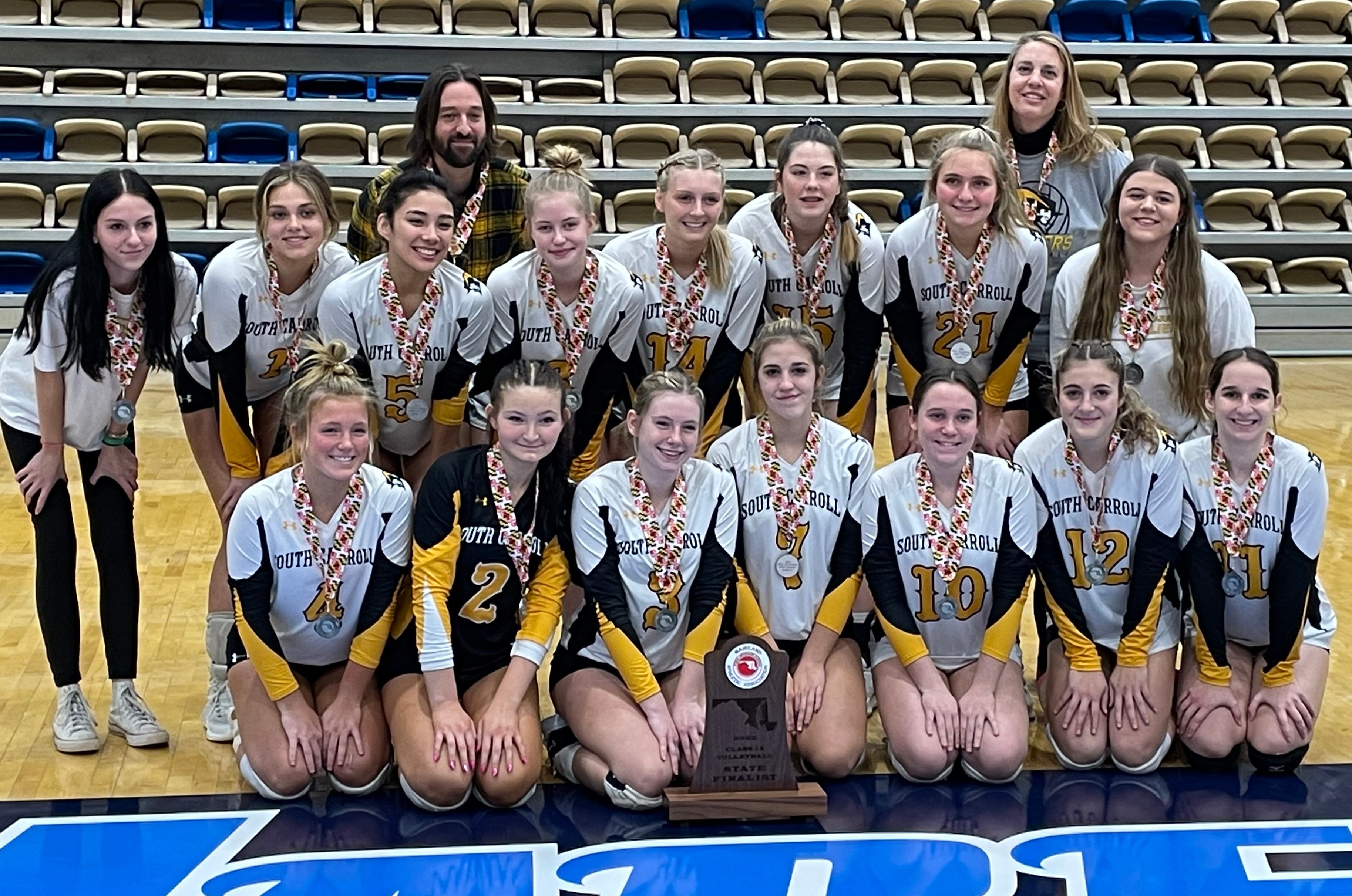 South Carroll volleyball gathered for a team photo with the 1A state runner-up trophy after falling to Clear Spring, in three sets, in the championship match.