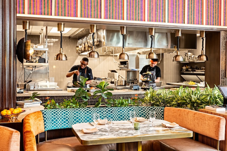 Jones (pictured left in the Marcus DC kitchen), whose career began in a Ledo Pizza kitchen, has now been featured on popular cooking competition shows “Chopped” and “Top Chef.”