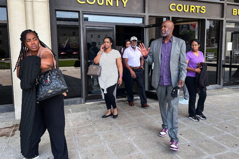 The family of Phylicia Barnes, who was killed in 2010, leave the Baltimore County Courthouse on Monday after watching her convicted and later acquitted killer sentenced two life terms for raping a young woman.