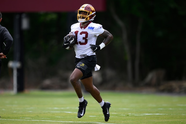 Washington Commanders wide receiver Treylon Burks works out during practice on June 9.