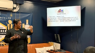 Cortnie Burriss hosts a game night every first Thursday of the month at Upper Marlboro’s Free State Distillery. Patrons play “Talk Your Suit,” a game Burriss originally created for her high school literature students and encourages players to use different conversation skills.