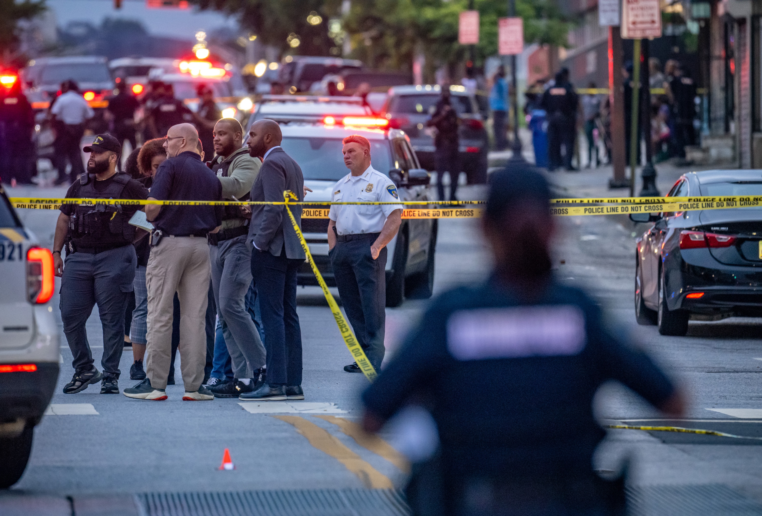 Baltimore Police Commissioner Richard Worley, right, stands at the scene of an officer-involved shooting on Pennsylvania Avenue in Baltimore on Tuesday.