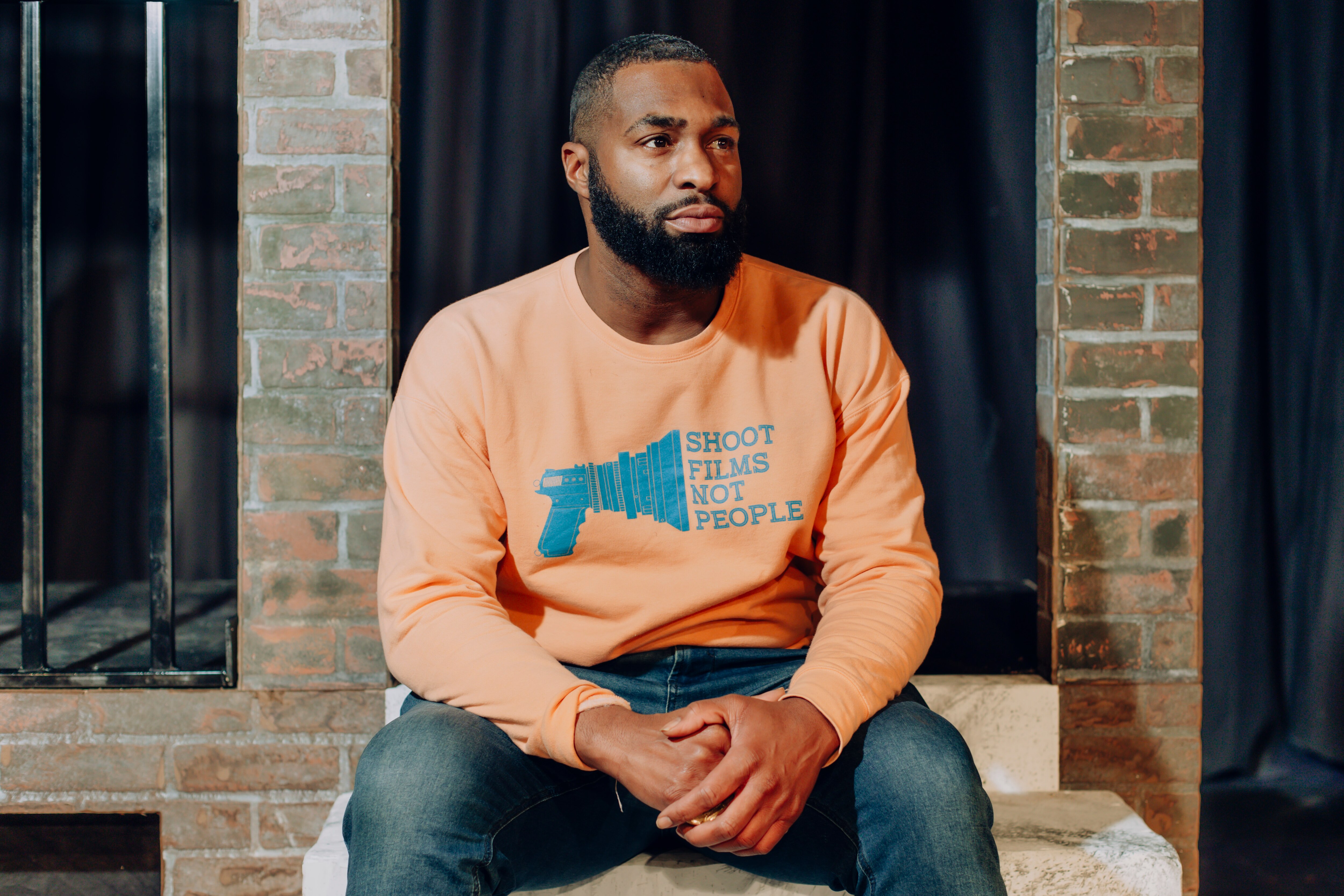 Robert Lee Hardy, star of Marty and the Hands That Could, sits on the stage at Arena Players Incorporated, where the play is being shown, on Monday, Jan. 22, 2024 in Baltimore, MD. Arena Players Incorporated is the theater where Hardy took his first steps into acting before moving to Los Angeles.