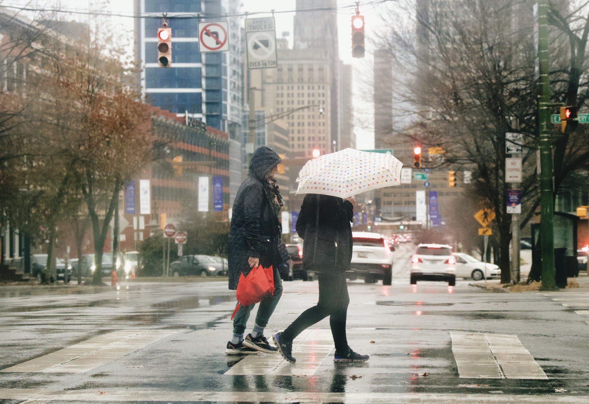 Residents of South Baltimore brave the downpour on December 11, 2024.