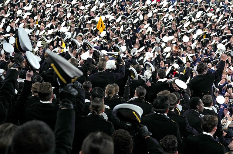 SATURDAY DECEMBER 13, 2025 - Navy Midshipmen go wild in the stands as they celebrate their 17-16 win over Army in the Army-Navy game at M&T Bank Stadium in Baltimore.