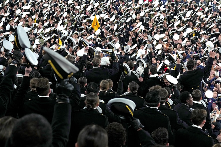 SATURDAY DECEMBER 13, 2025 - Navy Midshipmen go wild in the stands as they celebrate their 17-16 win over Army in the Army-Navy game at M&T Bank Stadium in Baltimore.