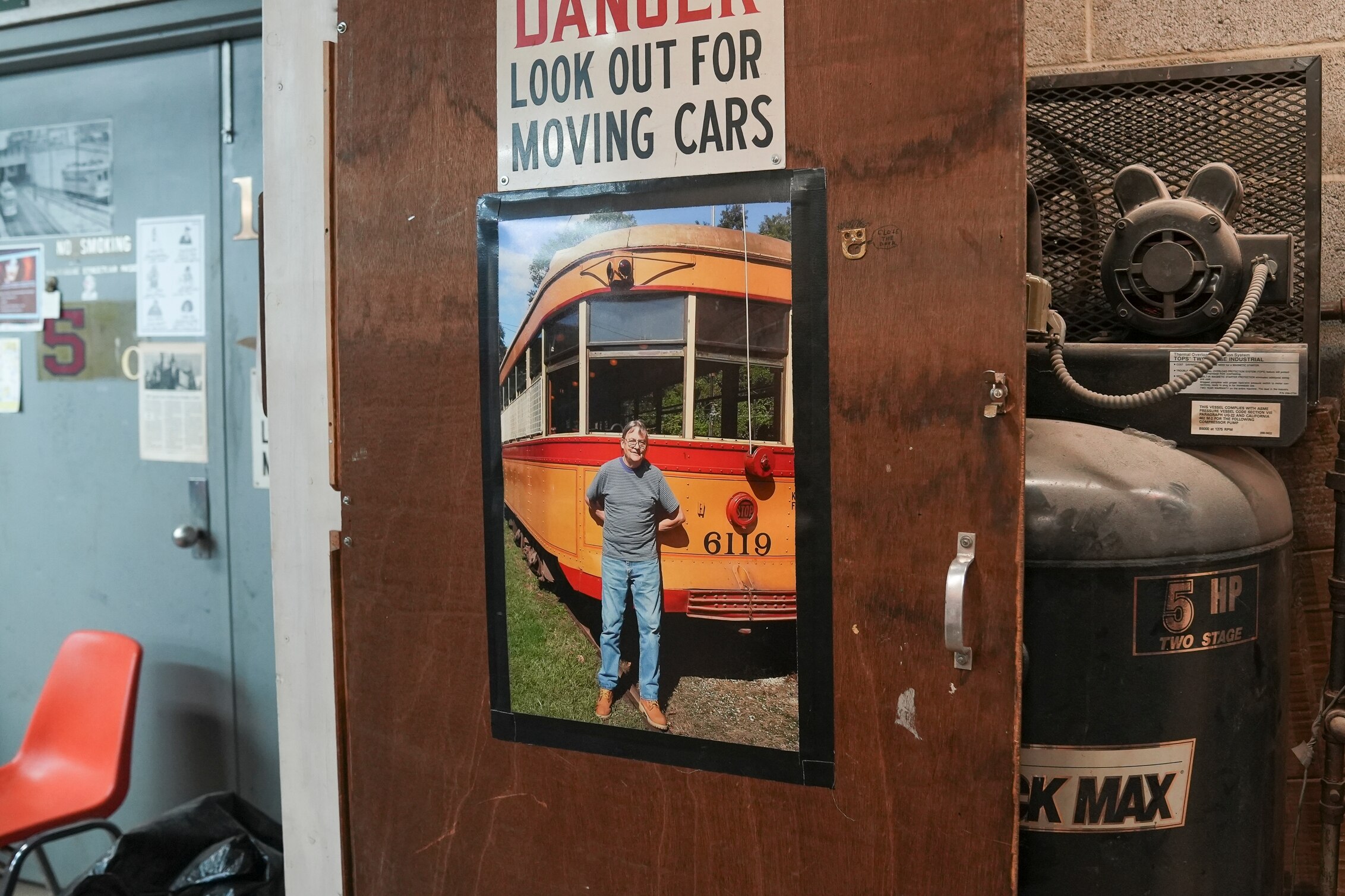 A photo of Buster Hughes is kept on the door of his workshop by Christopher McNally, who knew him for more than 20 years. June 11, 2025