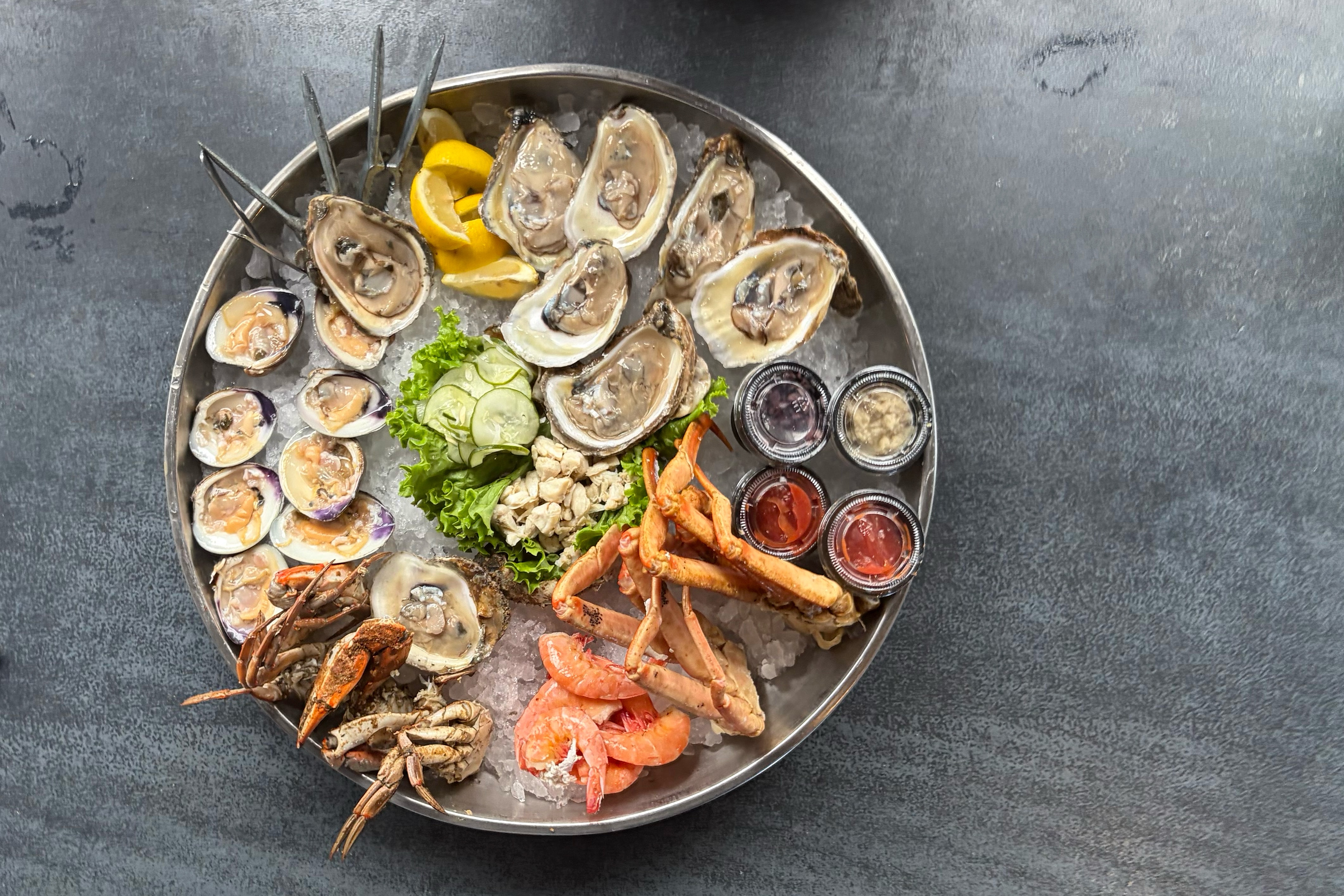 The Cold Seafood Platter, featuring raw oysters and clams, shrimp, snow crab leg clusters, jumbo lump crabmeat and two medium Maryland crabs at Nick's Fish House.