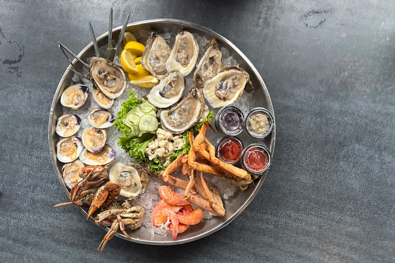 The Cold Seafood Platter, featuring raw oysters and clams, shrimp, snow crab leg clusters, jumbo lump crabmeat and two medium Maryland crabs at Nick's Fish House.