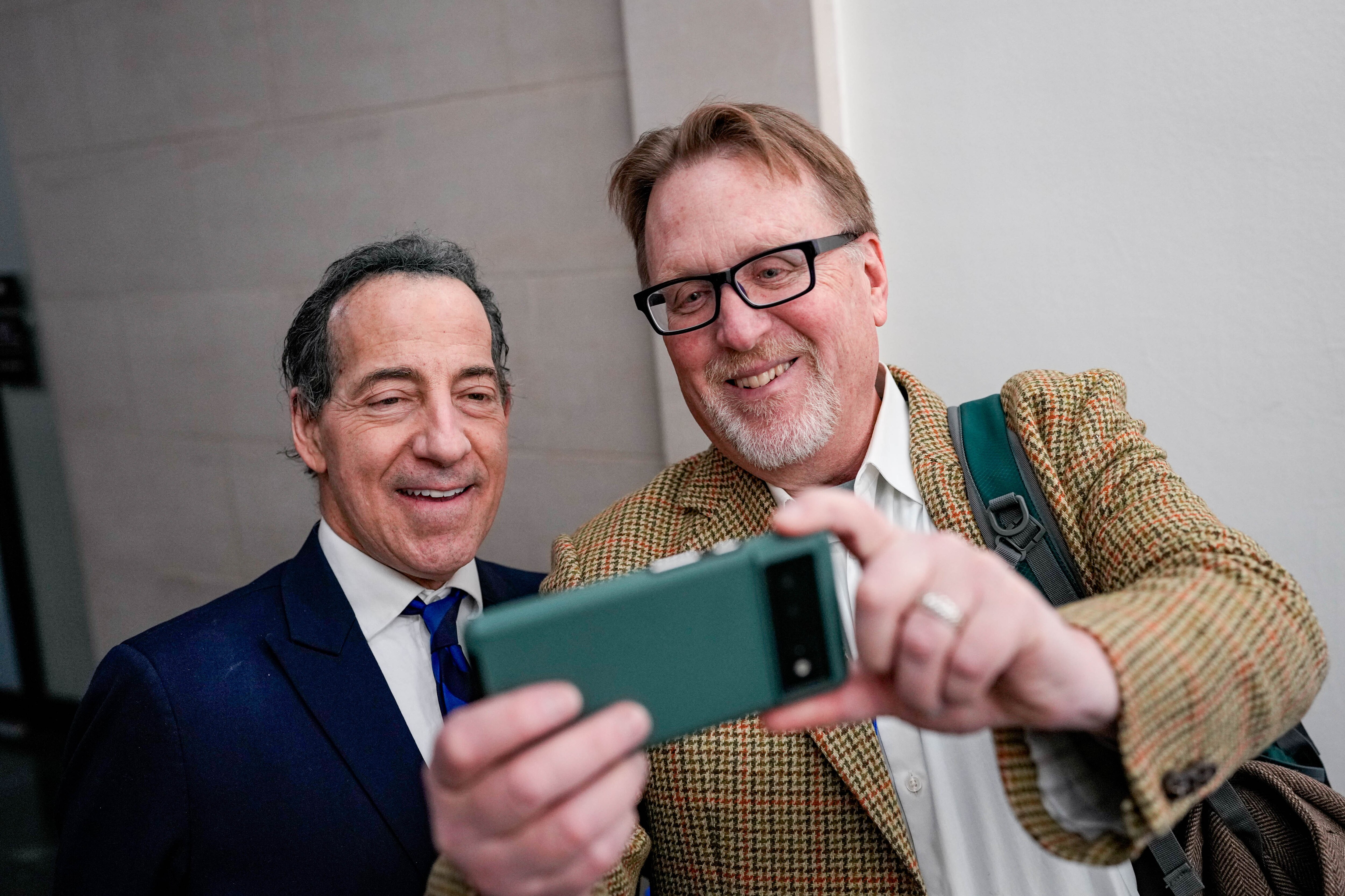 U.S. Rep. Jamie Raskin, left, takes a selfie with Baltimore Banner columnist Rick Hutzell in the Longworth House Office Building on Friday.