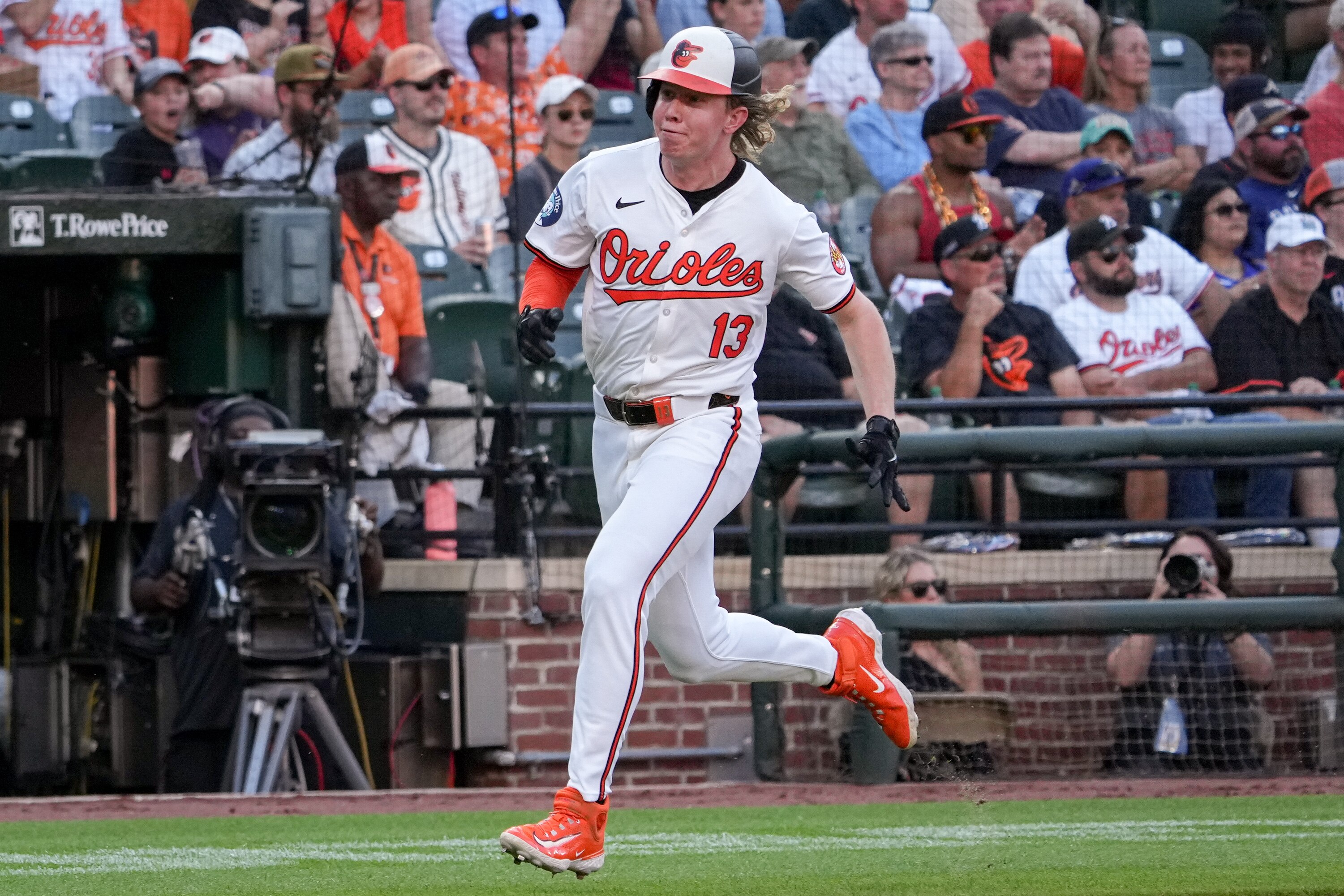 Baltimore Orioles right fielder Heston Kjerstad (13) runs to home plate to score during the first game of a series against the Texas Rangers at Camden Yards on June 27, 2024.