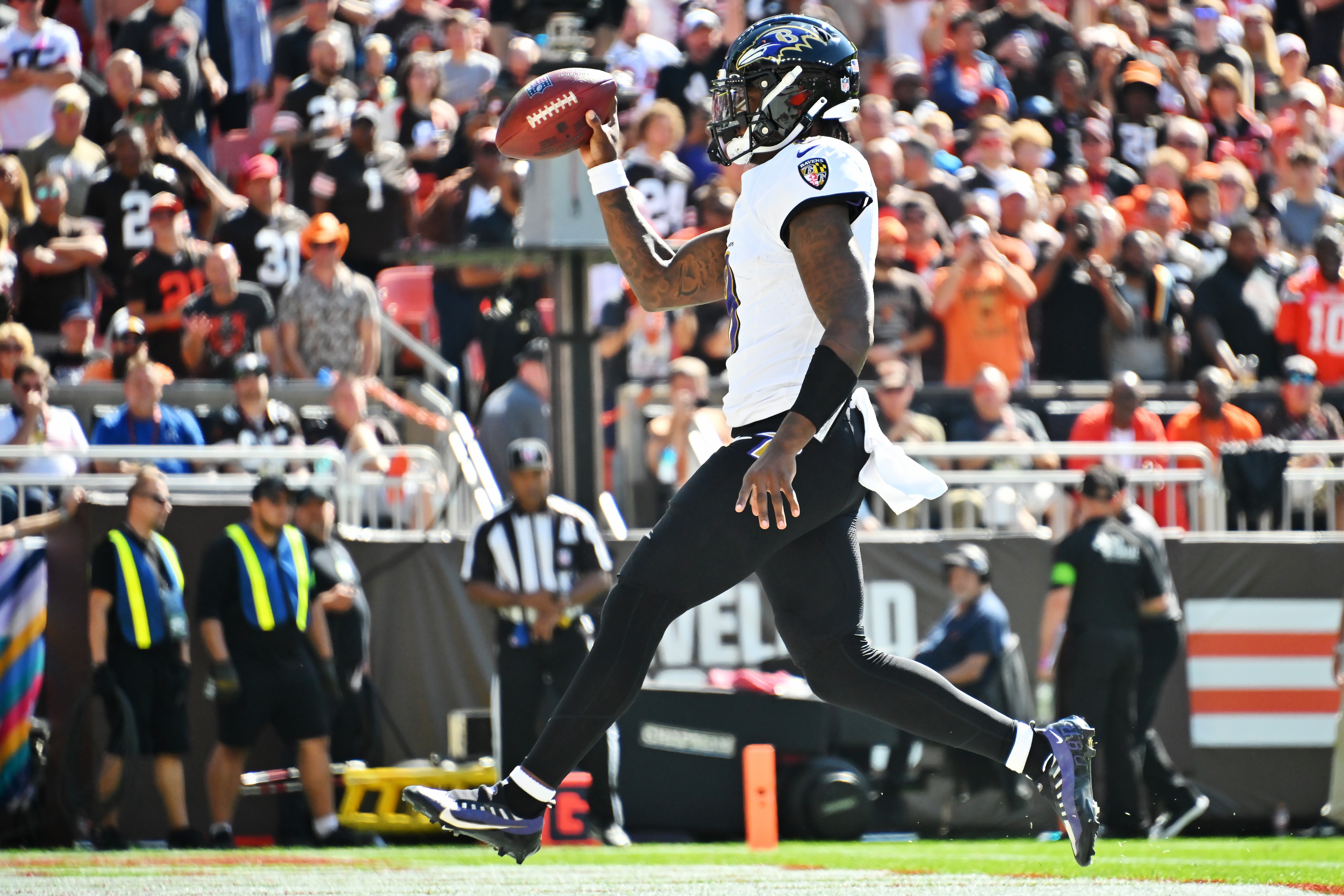 Lamar Jackson scores a rushing touchdown, one of his two in the first half of the Ravens' 28-3 at Cleveland.