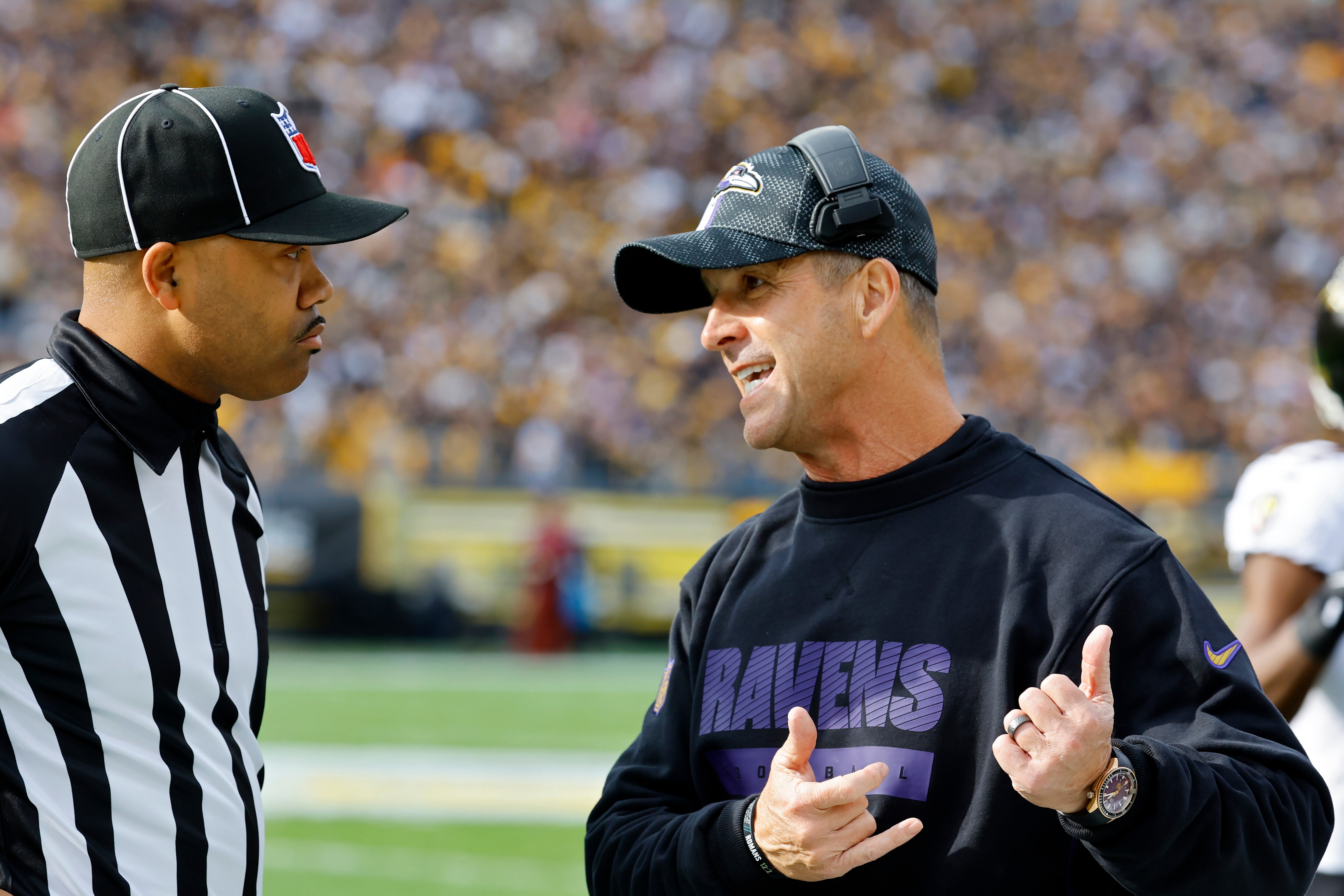PITTSBURGH, PENNSYLVANIA - NOVEMBER 17: Head coach John Harbaugh of the Baltimore Ravens talks to an official in the first quarter of a game against the Pittsburgh Steelers at Acrisure Stadium on November 17, 2024 in Pittsburgh, Pennsylvania. (Photo by Justin K. Aller/Getty Images)