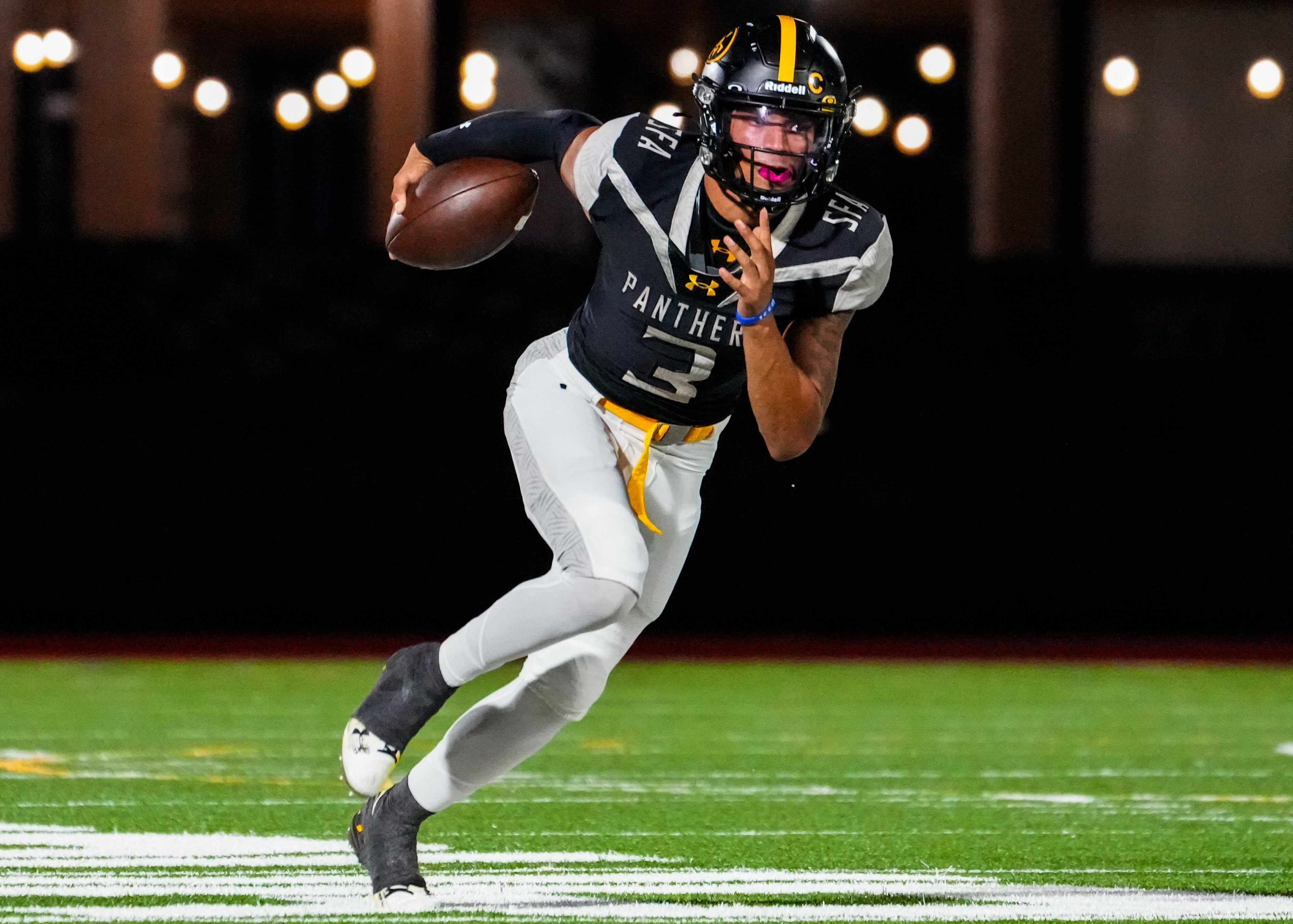 St. Frances quarterback Michael Van Buren runs with the ball during the first quarter against St. Thomas More at Under Armour Stadium in Baltimore on Saturday, Sept. 30, 2023.