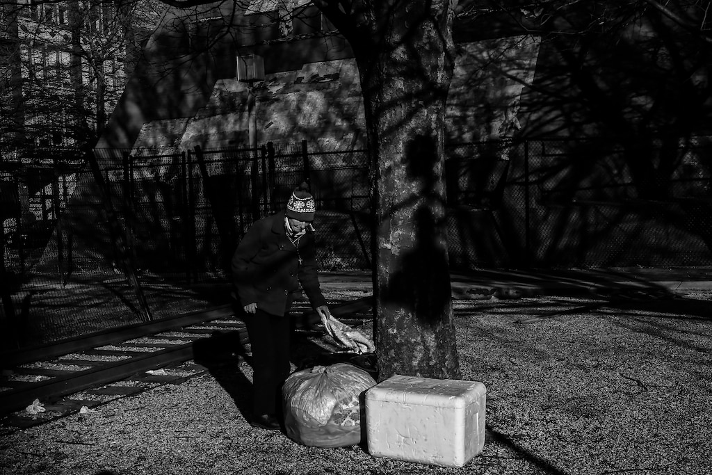 Michelle piles up trash she collected at the Baltimore Holocaust Memorial.