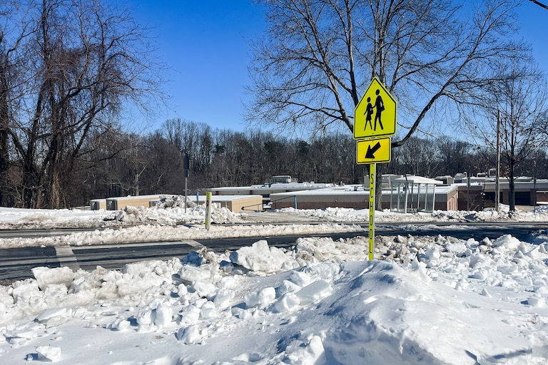 An ice-covered crosswalk in Rockville shows the road conditions that Montgomery County Public Schools are evaluating before deciding to open campuses