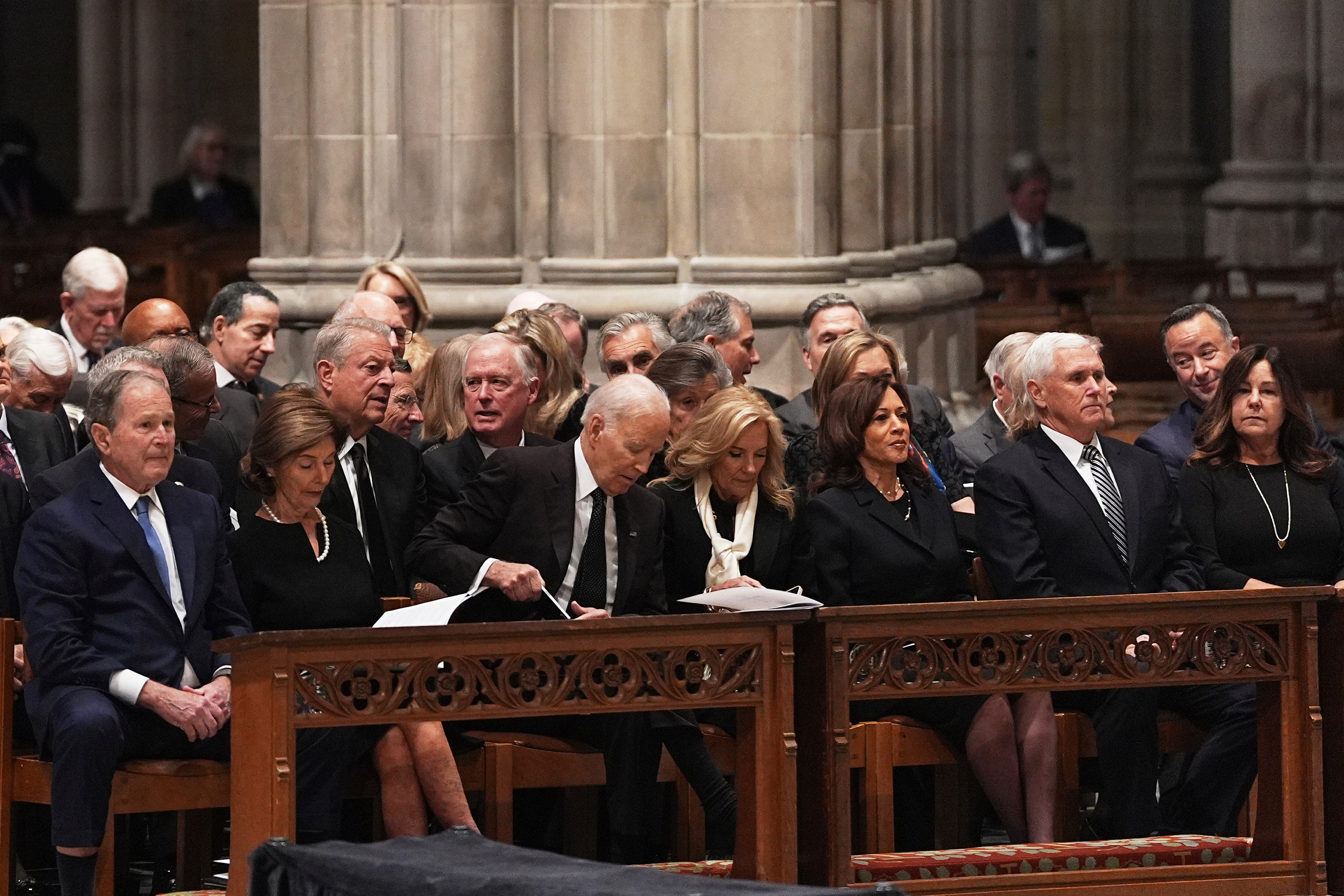 Former Presidents front row from left, George W. Bush with Laura Bush, Joe Biden with Jill Biden and former Vice Presidents Kamala Harris and Mike Pence with Karen Pence, right, during the funeral for former Vice President Dick Cheney at the Washington National Cathedral on Thursday, Nov. 20, 2025 in Washington. (AP Photo/Matt Rourke)