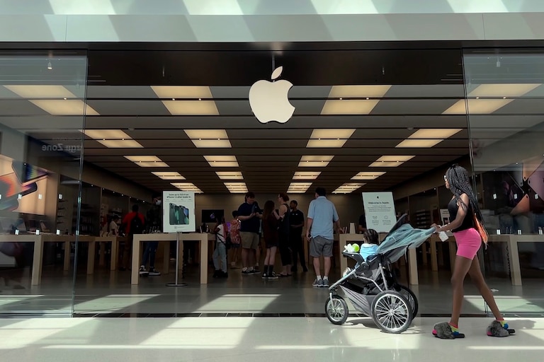 TOWSON, MARYLAND - JUNE 20: Customers shop at The Apple Store at the Towson Town Center mall, the first of the company's retail locations in the U.S. where workers voted over the weekend to unionize, on June 20, 2022 in Towson, Maryland. Following a late-pandemic era wave of workers demanding higher pay, better benefits and more negotiating leverage, 65 of the 98 workers at the Towson Apple Store voted to join the International Association of Machinists and Aerospace Workers union on June 18.