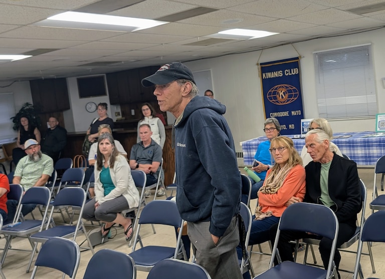 Patrick Stevens asks a question of the three major Democratic candidates for Anne Arundel County executive during a forum May 6, 2026 at the Commodore Mayo Kiwanis Hall.